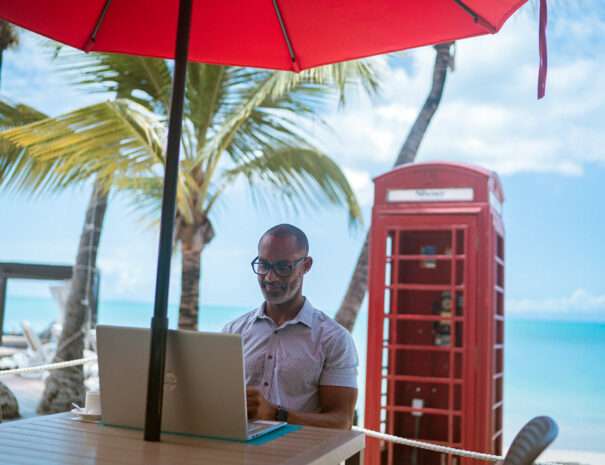 siboney-man-working-near-phone-booth